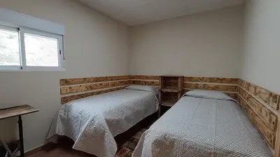 Cama o camas de una habitación en Posada Rancho Malcaminos