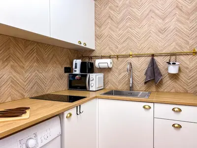 Una cocina o zona de cocina en Coastal Escape 1BD Flat with Terrace