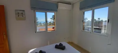 Cama o camas de una habitación en Vera Mar 5 Front Line Beach Apartment