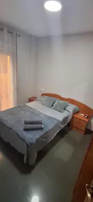 Cama o camas de una habitación en Coqueto apartamento a paso de la playa