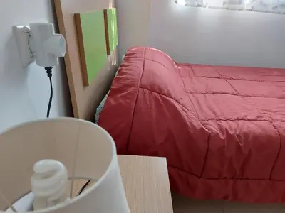 Cama o camas de una habitación en Apartamento Alborania II con patio gande y aparcamiento, entre el mar y del desierto