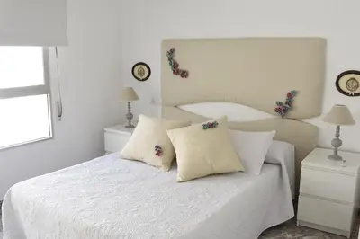 Cama o camas de una habitación en Alojamiento Vacacional Águilas de Poniente