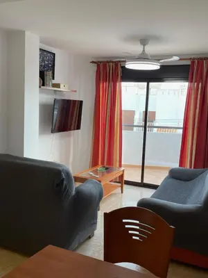 Una televisión o centro de entretenimiento en Luxury apartment a 50m del mar