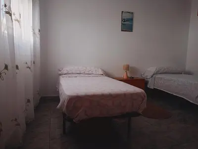 Cama o camas de una habitación en Amplio apartamento en zona céntrica de Nijar