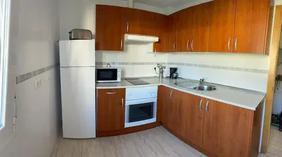 Una cocina o zona de cocina en Bonito y tranquilo piso en Almerimar
