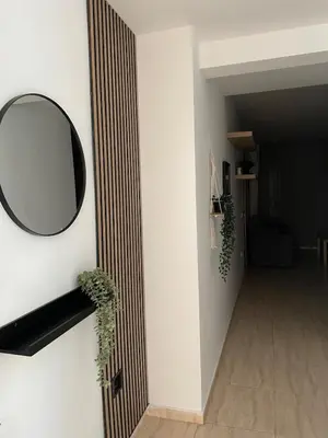 Una televisión o centro de entretenimiento en Bonito y tranquilo piso en Almerimar