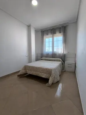 Cama o camas de una habitación en APARTAMENTO TURISTICO 3ºA CARLOS III - Cerca de la playa
