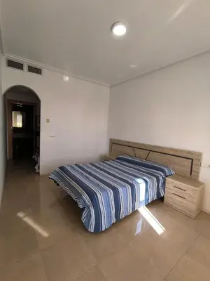 Cama o camas de una habitación en APARTAMENTO TURISTICO 3ºE CARLOS III - Cerca de la playa