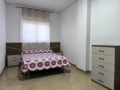 Cama o camas de una habitación en APARTAMENTO TURISTICO 3ºE CARLOS III - Cerca de la playa