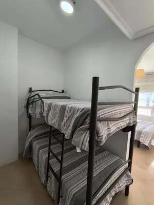 Cama o camas de una habitación en APARTAMENTOS TURISTICOS 4ºD CARLOS III - Cerca de la playa