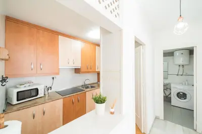 Una cocina o zona de cocina en Expoholidays - Eucalipto 1º