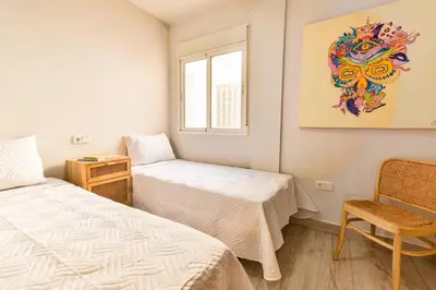 Cama o camas de una habitación en Apartamento con Terraza, Piscina y Parking By Aloha Palma