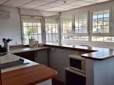 Una cocina o zona de cocina en Apartamento Almeria Playa