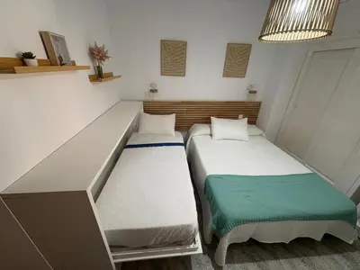 Cama o camas de una habitación en Playamar - RETAMAR EXPERIENCE