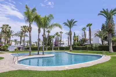 Piscina en o cerca de Vera Playa El Oasis Bajo con Jardin y Piscinas
