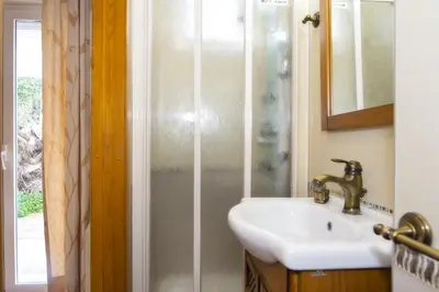 Un baño de Vera Playa El Oasis Bajo con Jardin y Piscinas