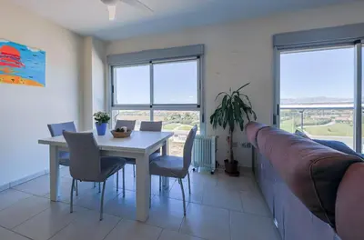 Zona de estar de Apart Barlovento con piscina a 10 min de la playa