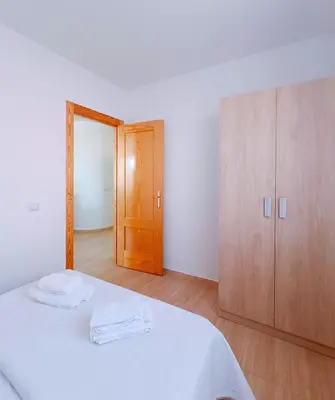 Cama o camas de una habitación en Cala Grande suites 3 hab, vistas al mar y terraza