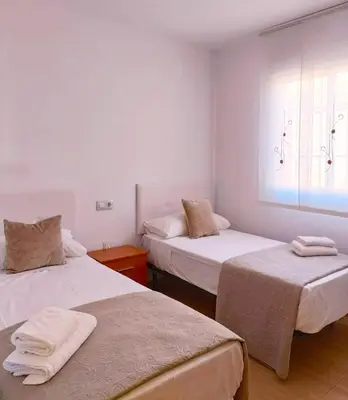 Cama o camas de una habitación en Cala Grande suites 3 hab, vistas al mar y terraza