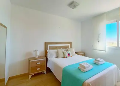Cama o camas de una habitación en Cala Grande suites 3 hab, vistas al mar y terraza