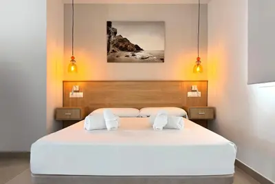Cama o camas de una habitación en El Oasis de San José
