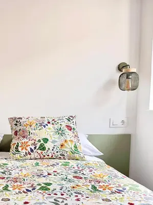 Cama o camas de una habitación en Placeta Serna El Capricho