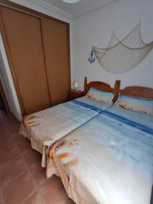 Cama o camas de una habitación en Golf Marina de la Torre con vistas al mar