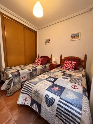 Cama o camas de una habitación en Golf Marina de la Torre con vistas al mar