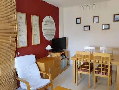 Una televisión o centro de entretenimiento en Apartamento Vera-playa