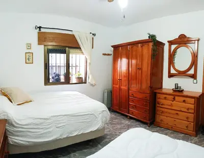 Cama o camas de una habitación en Casa Rural en Padules GR