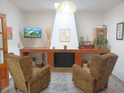 Una televisión o centro de entretenimiento en Casa Rural en Padules GR