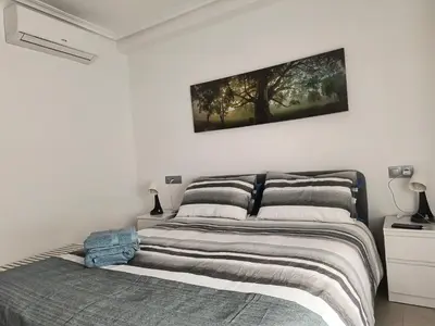 Cama o camas de una habitación en vera playa atico balcón al mediterráneo