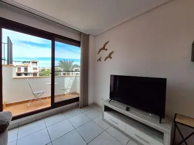 Una televisión o centro de entretenimiento en Jardines de Nuevo Vera - Junto al mar
