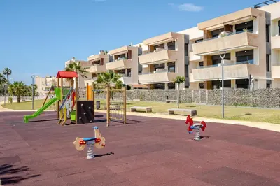 Zona de juegos infantil en Cozy Apt 3BR, Near Cabo de Gata, Beach, Gym, Pool, Golf