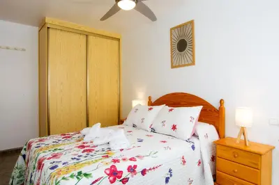 Cama o camas de una habitación en Apartamento céntrico Belquimar a pocos pasos de la playa