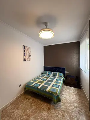 Cama o camas de una habitación en Orilla playa Balerma