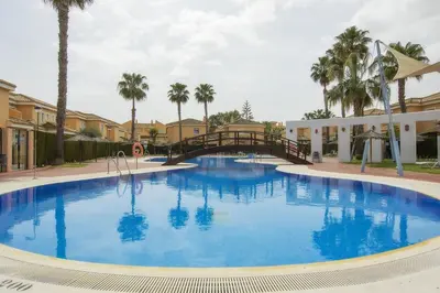 Piscina en o cerca de Vera Playa Chalet Adosado Jardín Piscina Parking