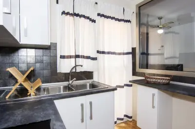 Una cocina o zona de cocina en Vera Playa Chalet Adosado Jardín Piscina Parking