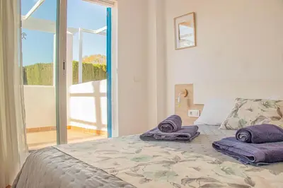 Cama o camas de una habitación en MojacarProperty Noalejo Beach Apartment