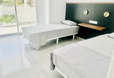 Cama o camas de una habitación en Villa Habana - Luxury beach apartment with rooftop spa