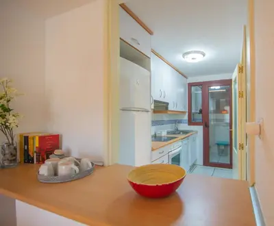 Una cocina o zona de cocina en Mediterranea 11 Vera Playa Jardines tus momentos frente al mar