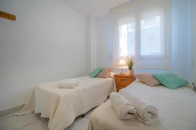 Cama o camas de una habitación en Mediterranea 11 Vera Playa Jardines tus momentos frente al mar