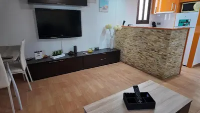 Una televisión o centro de entretenimiento en Apartalux Pax Palace