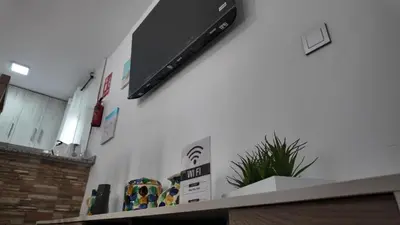 Una televisión o centro de entretenimiento en Apartalux Luna de las Negras