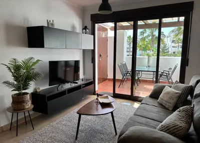 Una televisión o centro de entretenimiento en Appartement Salinalux Vera Playa