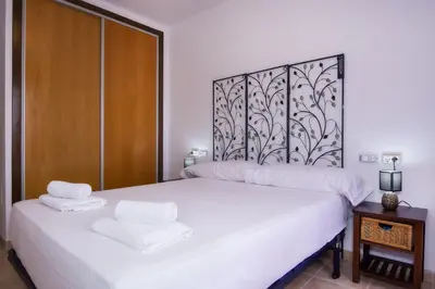 Cama o camas de una habitación en Águilas Excelente Alojamiento Collados Resort