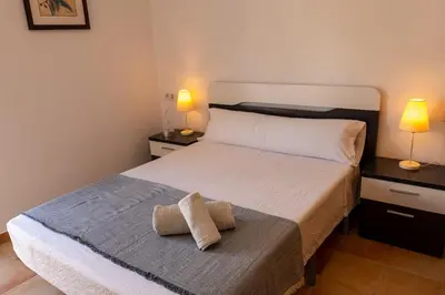 Cama o camas de una habitación en Villa de 4 dormitorios en el Resort Playa Macenas