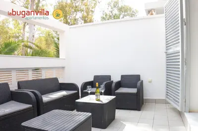 Zona de estar de Apartamentos la Buganvilla