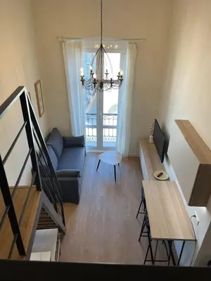 Una televisión o centro de entretenimiento en Apartamento junto a la Plaza del Ayuntamiento