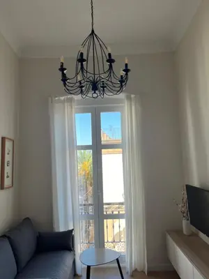 Una televisión o centro de entretenimiento en Apartamento junto a la Plaza del Ayuntamiento